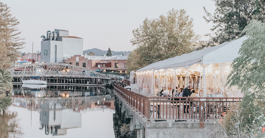 The Petaluma River in Downtown Petaluma, Ca featuring outdoor restaurant seating at Seared